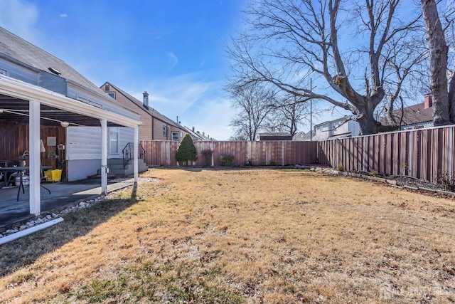 view of yard featuring a fenced backyard and a patio area