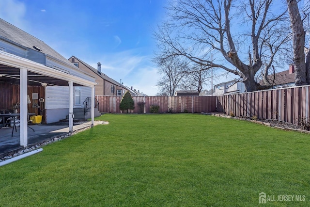 view of yard featuring a patio and a fenced backyard