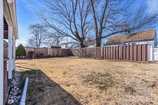 view of yard with a fenced backyard