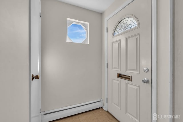 entryway with light tile patterned floors and a baseboard heating unit