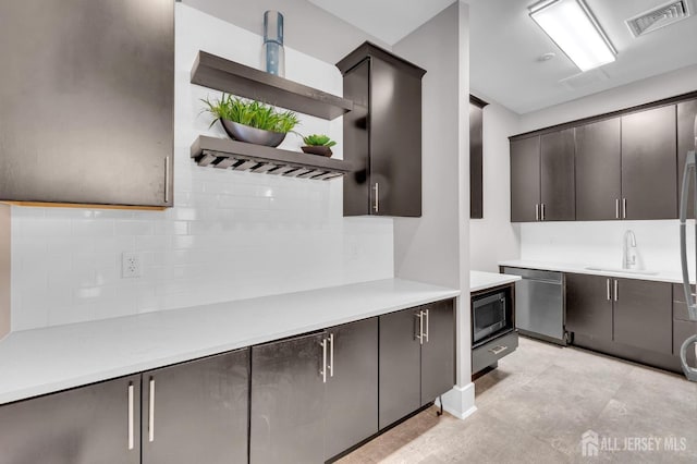 kitchen with built in microwave, dishwasher, sink, and backsplash