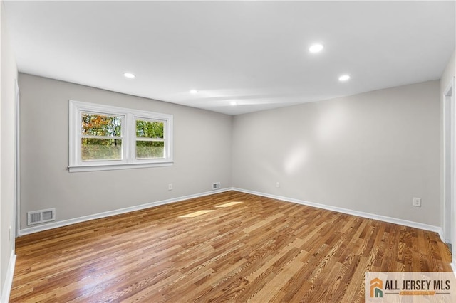 empty room with light hardwood / wood-style floors