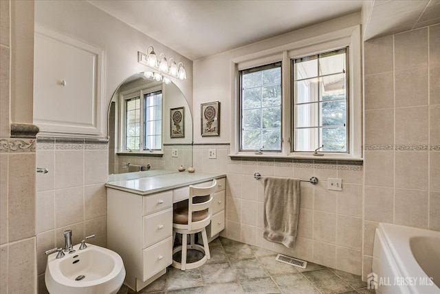 64 Annette Dr, Edison, NJ 08820 - full bath with tile walls, vanity, a bidet, a tub, and tile patterned flooring