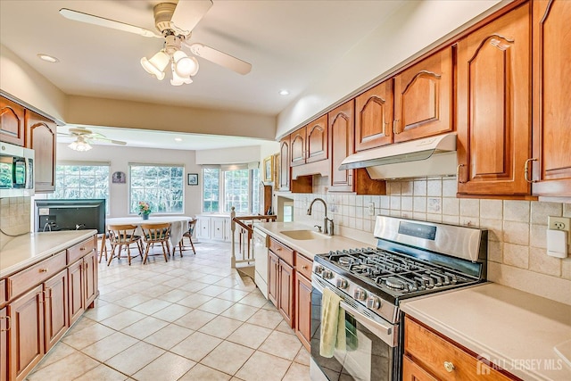 64 Annette Dr, Edison, NJ 08820 - kitchen with appliances with stainless steel finishes, under cabinet range hood, ceiling fan, light countertops, and recessed lighting