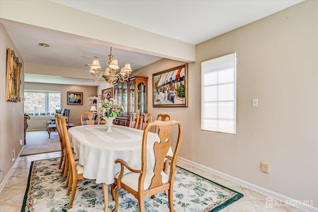 64 Annette Dr, Edison, NJ 08820 - dining area with a chandelier and light tile patterned flooring