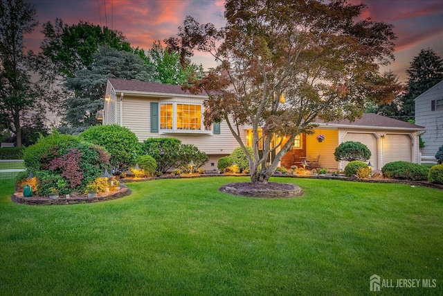64 Annette Dr, Edison, NJ 08820 - tri-level home featuring a front lawn and an attached garage