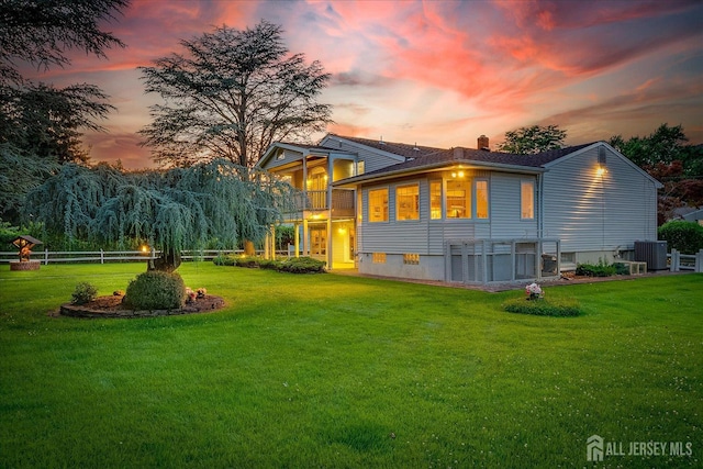 64 Annette Dr, Edison, NJ 08820 - back of property at dusk with a chimney and a balcony