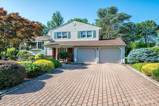 64 Annette Dr, Edison, NJ 08820 - split level home featuring driveway, a garage, and a shingled roof