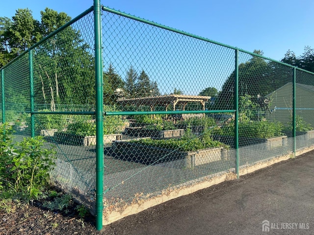 64 Annette Dr, Edison, NJ 08820 - view of tennis court featuring a garden