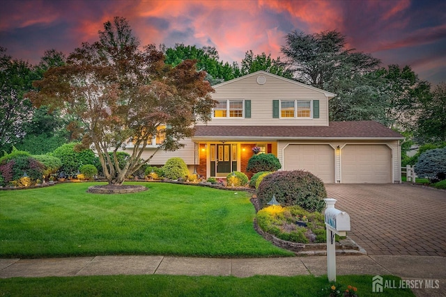 64 Annette Dr, Edison, NJ 08820 - view of front of house featuring decorative driveway, a front lawn, and an attached garage