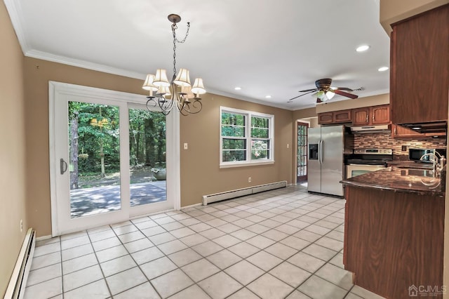 kitchen with backsplash, stainless steel appliances, sink, and baseboard heating