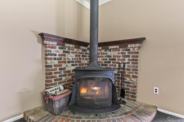 room details with ornamental molding and a wood stove