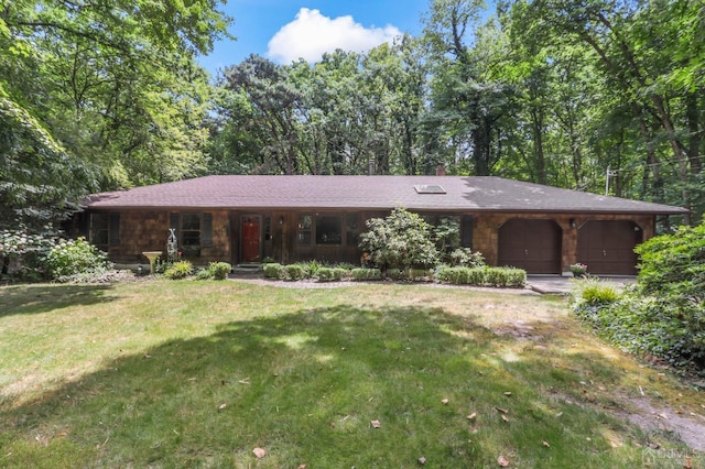 single story home with a garage and a front yard