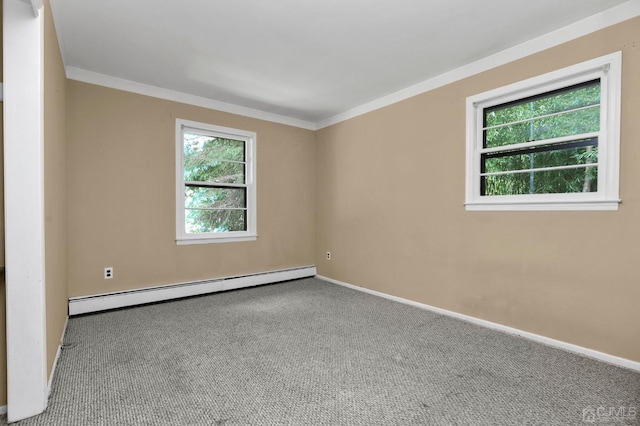 carpeted spare room with ornamental molding, a healthy amount of sunlight, and baseboard heating