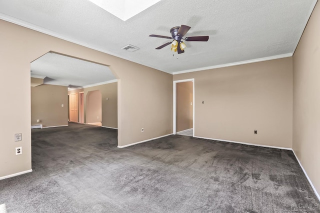 carpeted empty room with crown molding, a textured ceiling, and ceiling fan