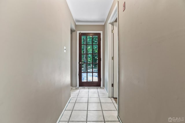 entryway with a healthy amount of sunlight and light tile patterned floors