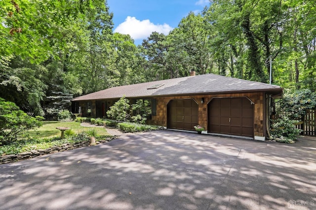 single story home featuring a garage