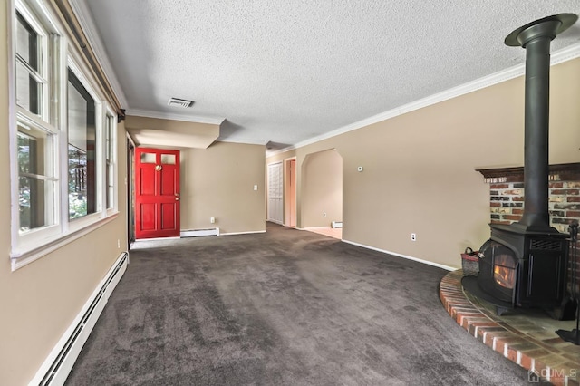 unfurnished living room with crown molding, dark carpet, a baseboard radiator, and a wood stove