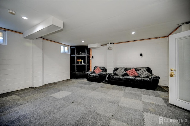 2 Eddie Ct, South Brunswick, NJ 08810 - carpeted living area featuring concrete block wall and recessed lighting