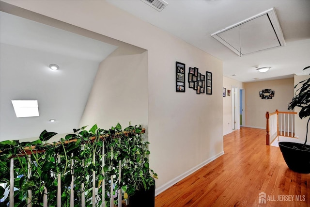 2 Eddie Ct, South Brunswick, NJ 08810 - hall with attic access, an upstairs landing, light wood-style flooring, and baseboards