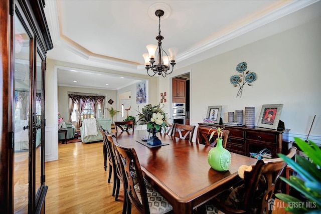 2 Eddie Ct, South Brunswick, NJ 08810 - dining area with a chandelier, light wood-type flooring, a raised ceiling, and crown molding