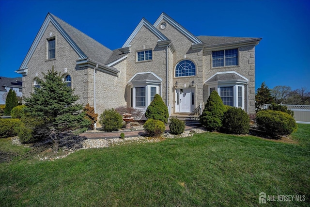 2 Eddie Ct, South Brunswick, NJ 08810 - view of front of property with a front yard and brick siding