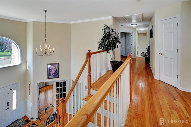 2 Eddie Ct, South Brunswick, NJ 08810 - entryway featuring light wood-style flooring, a chandelier, ornamental molding, and a towering ceiling