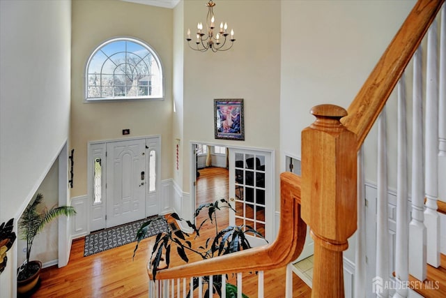 2 Eddie Ct, South Brunswick, NJ 08810 - entrance foyer featuring a towering ceiling, wood finished floors, and a chandelier