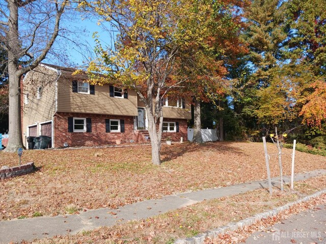 bi-level home featuring a garage