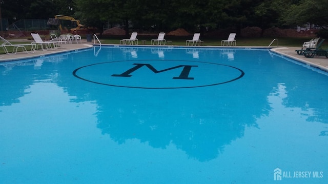 pool with a patio area