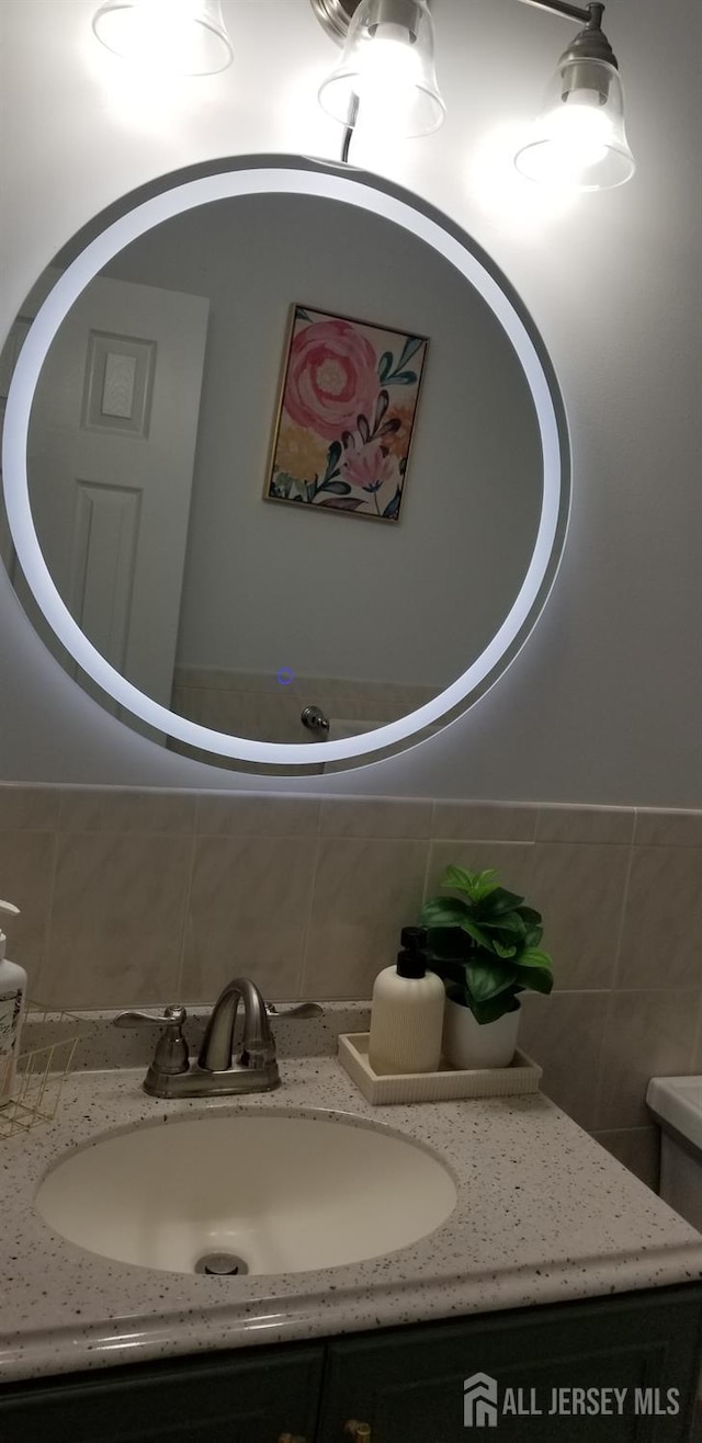 bathroom with backsplash and vanity