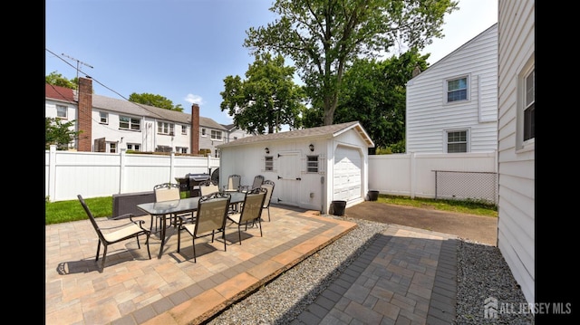 3 Mayfield Pl, Metuchen, NJ 08840 - view of patio / terrace featuring outdoor dining space, an outdoor structure, and a detached garage