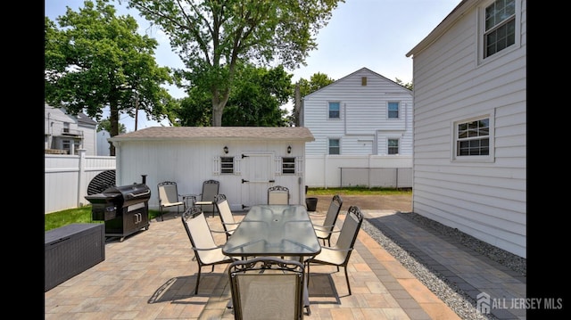 3 Mayfield Pl, Metuchen, NJ 08840 - view of patio featuring outdoor dining area, a grill, and an outdoor structure