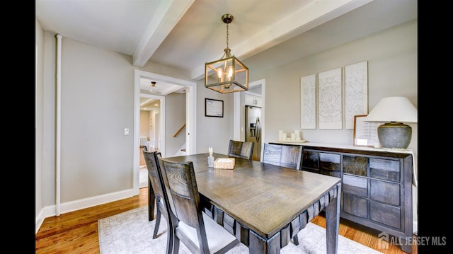 3 Mayfield Pl, Metuchen, NJ 08840 - dining space with beamed ceiling, a chandelier, light wood finished floors, and stairs