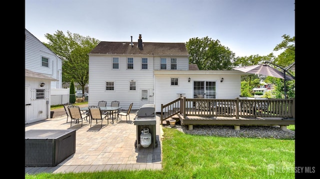 3 Mayfield Pl, Metuchen, NJ 08840 - back of property with outdoor dining area, a patio, a wooden deck, and a chimney