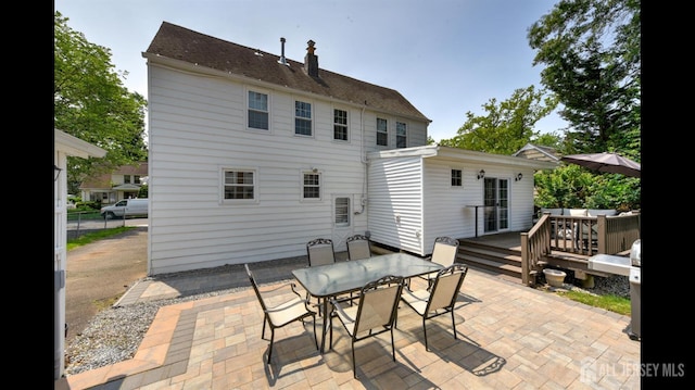 3 Mayfield Pl, Metuchen, NJ 08840 - back of property featuring outdoor dining space, a patio area, a chimney, and a deck