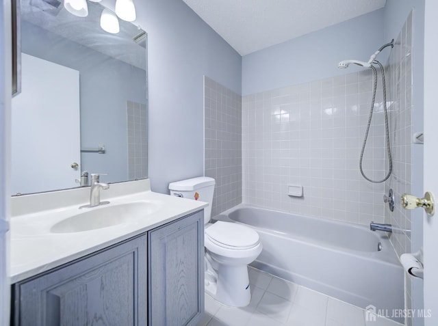 full bath with vanity, tile patterned floors, toilet, and shower / bath combination