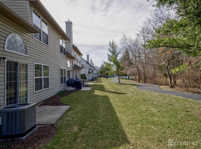 view of yard with cooling unit and a residential view