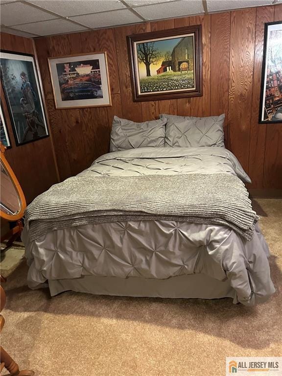 5 Serviss Ave, East Brunswick, NJ 08816 - carpeted bedroom with wooden walls and a paneled ceiling