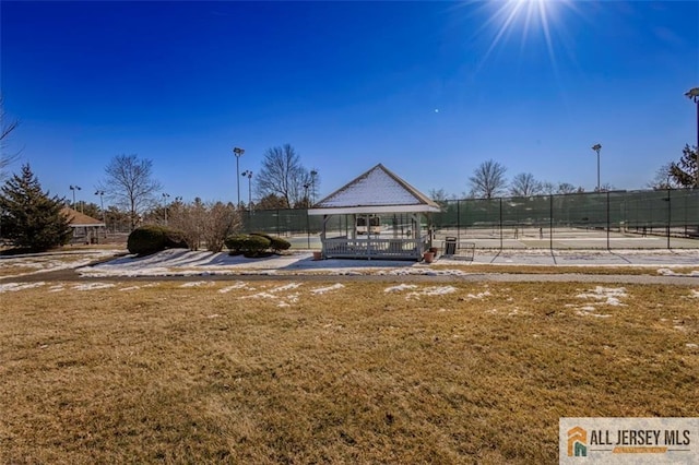 view of community with a gazebo, fence, and a yard