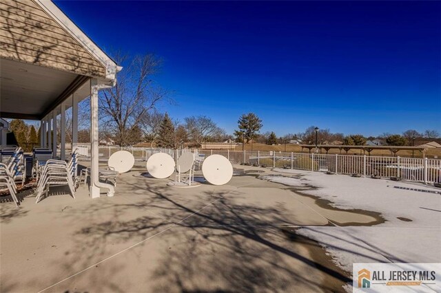 view of patio featuring fence