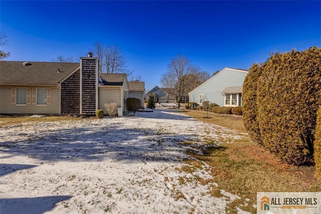 view of road with driveway and a residential view