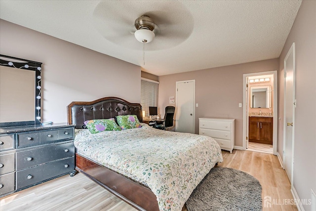 19 Carriage Pl, Edison, NJ 08820 - bedroom with light wood finished floors, a textured ceiling, ensuite bathroom, and ceiling fan