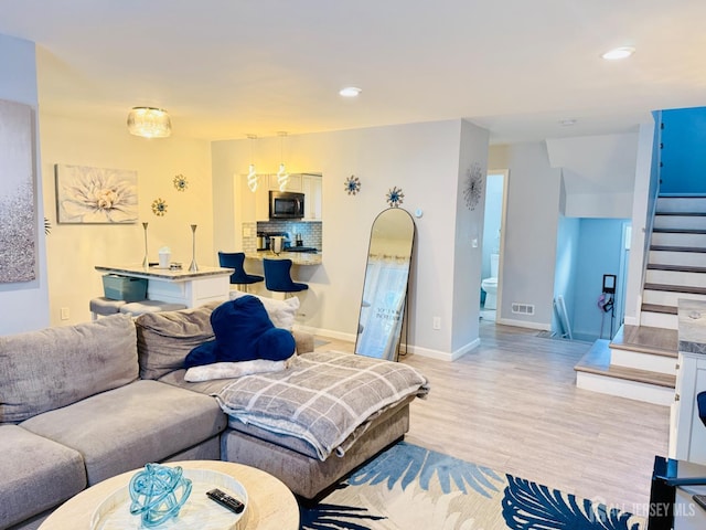 45 Marina View Dr, Sewaren, NJ 07077 - living room featuring stairway, light wood-style floors, and recessed lighting
