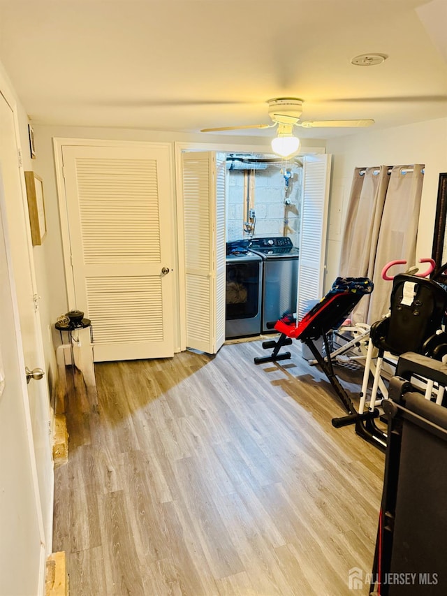 45 Marina View Dr, Sewaren, NJ 07077 - exercise area featuring wood finished floors, washer and dryer, and a ceiling fan
