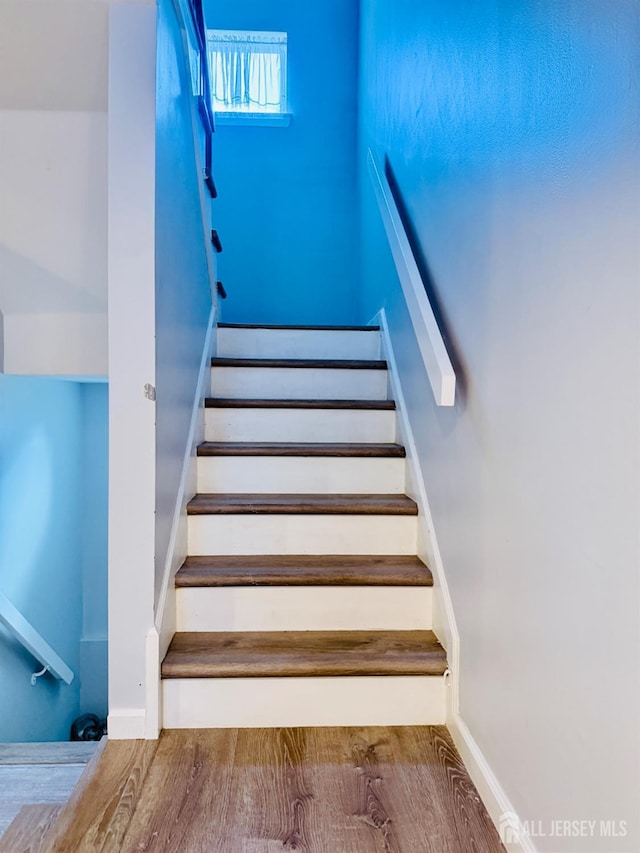 45 Marina View Dr, Sewaren, NJ 07077 - staircase featuring wood finished floors