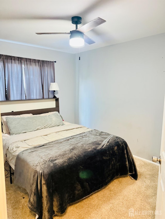 45 Marina View Dr, Sewaren, NJ 07077 - carpeted bedroom featuring a ceiling fan and baseboards