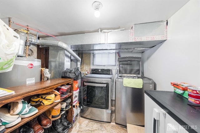 laundry area with laundry area, washer and clothes dryer, and gas water heater