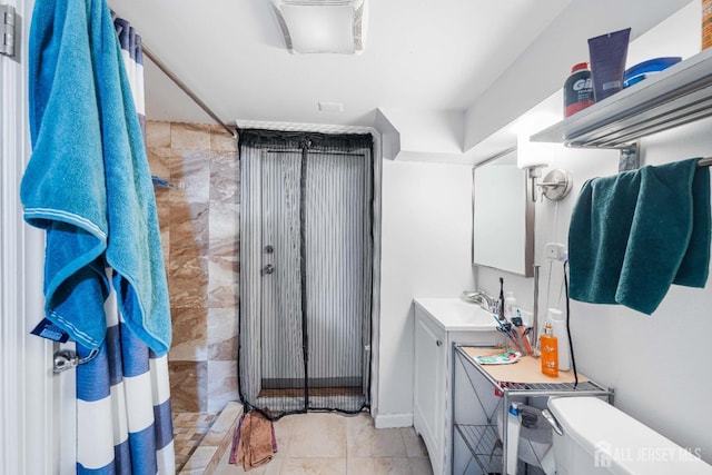 full bathroom featuring toilet and vanity