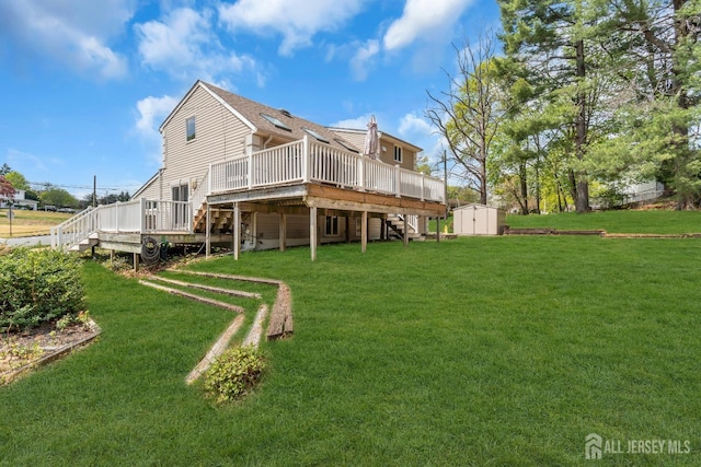 back of property featuring a wooden deck, a shed, a yard, an outbuilding, and stairway